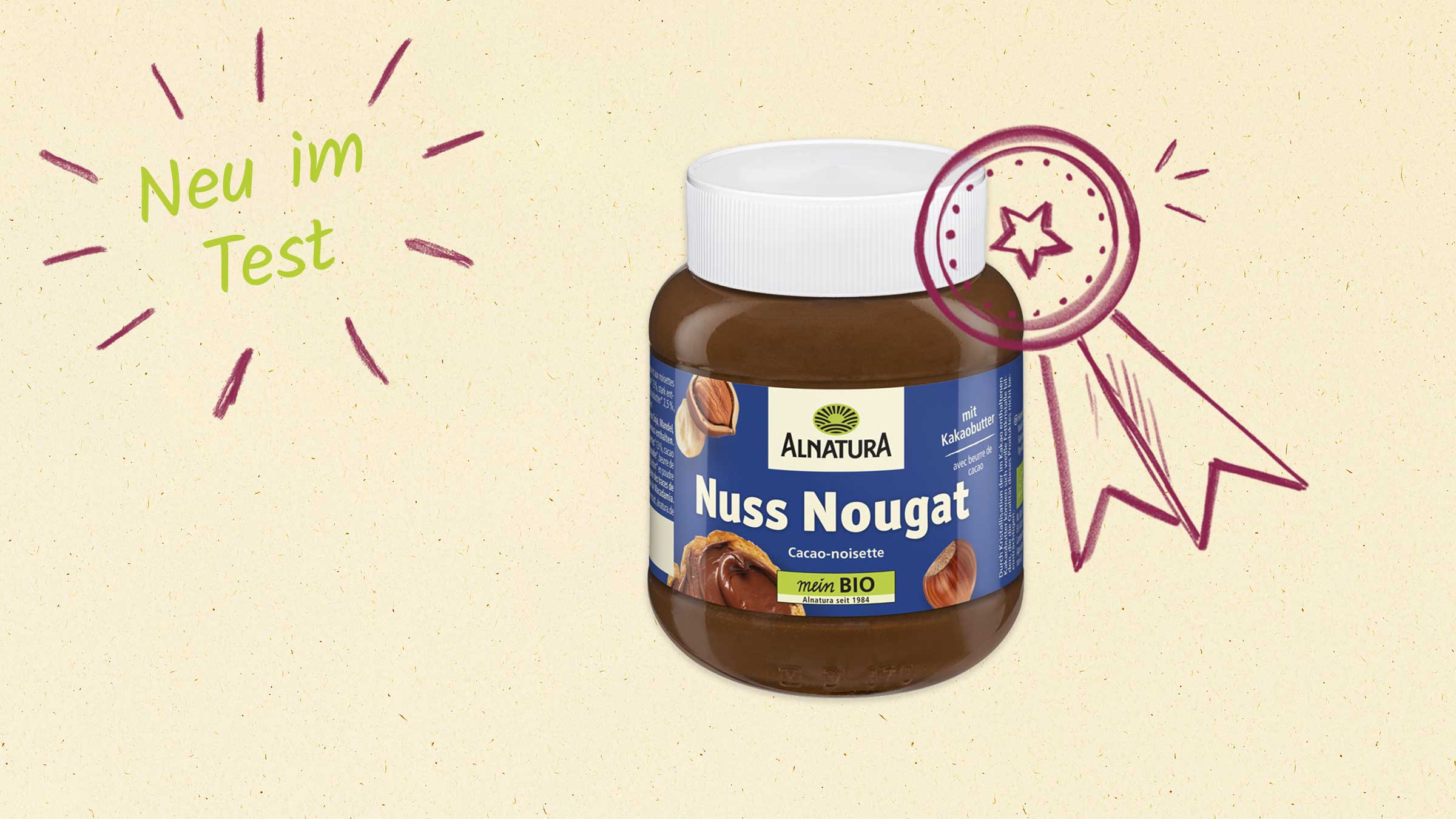 Ein Glas Alnatura Nuss Nougat mit dem Hinweis "Neu im Test" und einer handgezeichneten Auszeichnung.