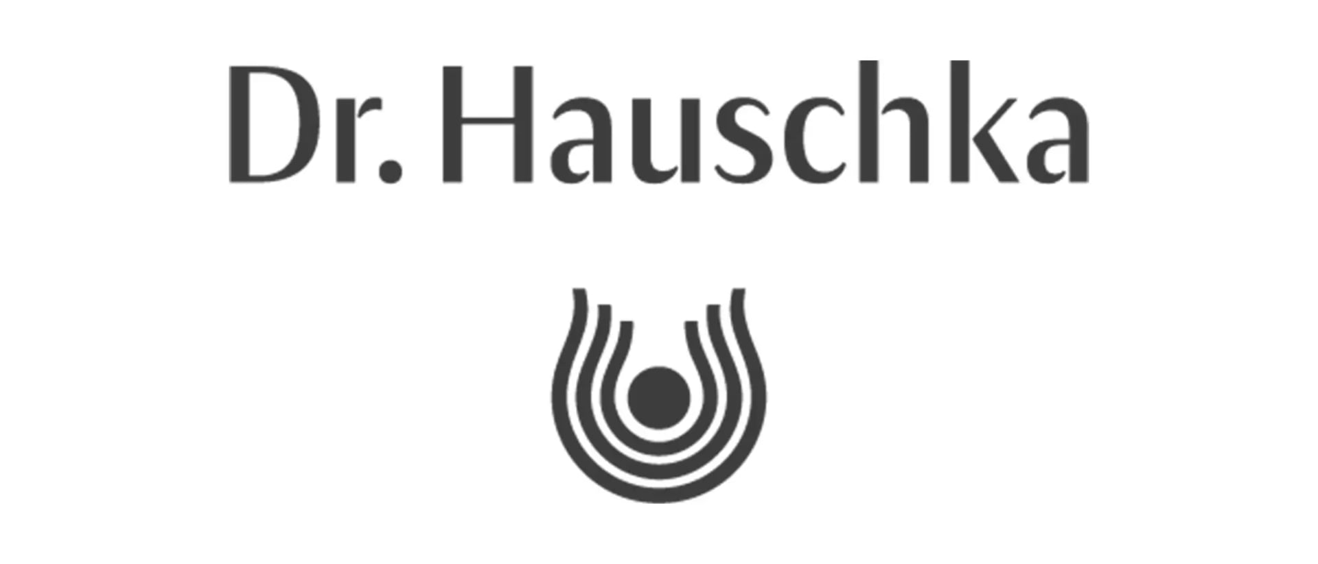 Schriftzug 'Dr. Hauschka' über einem stilisierten, konzentrischen Linienzeichen mit einem Punkt in der Mitte